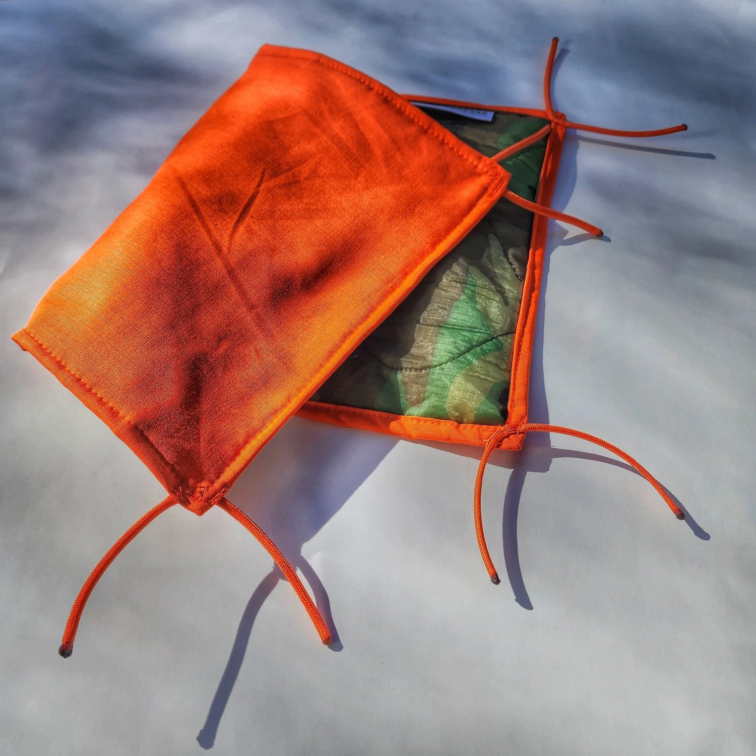 Woobie Hank: Insulated with USGI poncho-liner, serves as a large rag, knee pad, and adventure companion tool. Superesse Straps LLC