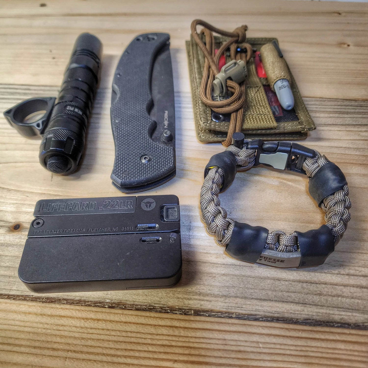 Urban Carry Strap - EDC Bracelet with Pry Bar, Firestarter, Kevlar Saw and Cuff Key or LED Flashlight. Superesse Straps LLC