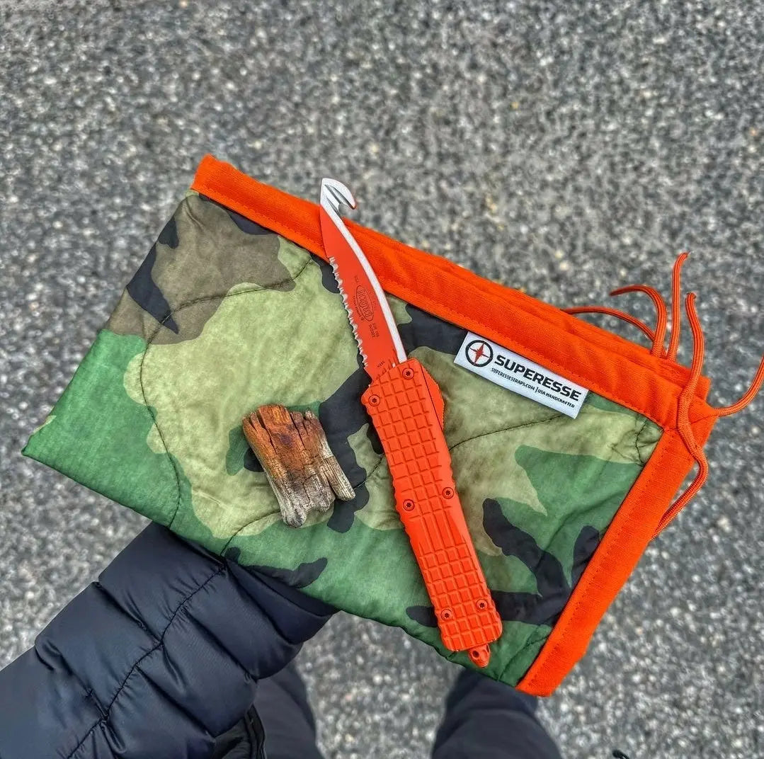 Woobie Hank: Insulated with USGI poncho-liner, serves as a large rag, knee pad, and adventure companion tool. Superesse Straps LLC