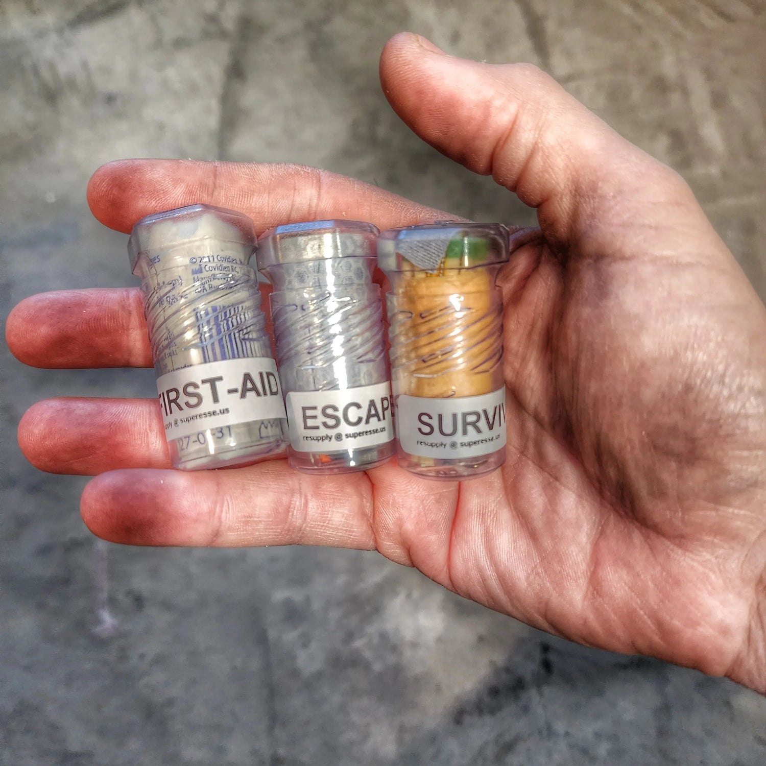 Drop Shell - Polymer Capsule filled with Survival, Escape, and First-Aid Supplies. Superesse Straps LLC