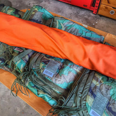 Woobie Hank: Insulated with USGI poncho-liner, serves as a large rag, knee pad, and adventure companion tool. Superesse Straps LLC