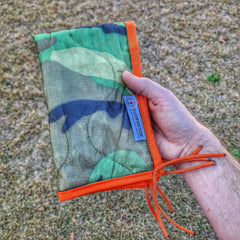 Woobie Hank: Insulated with USGI poncho-liner, serves as a large rag, knee pad, and adventure companion tool. Superesse Straps LLC