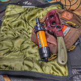 Woobie Hank: Insulated with USGI poncho-liner, serves as a large rag, knee pad, and adventure companion tool. Superesse Straps LLC