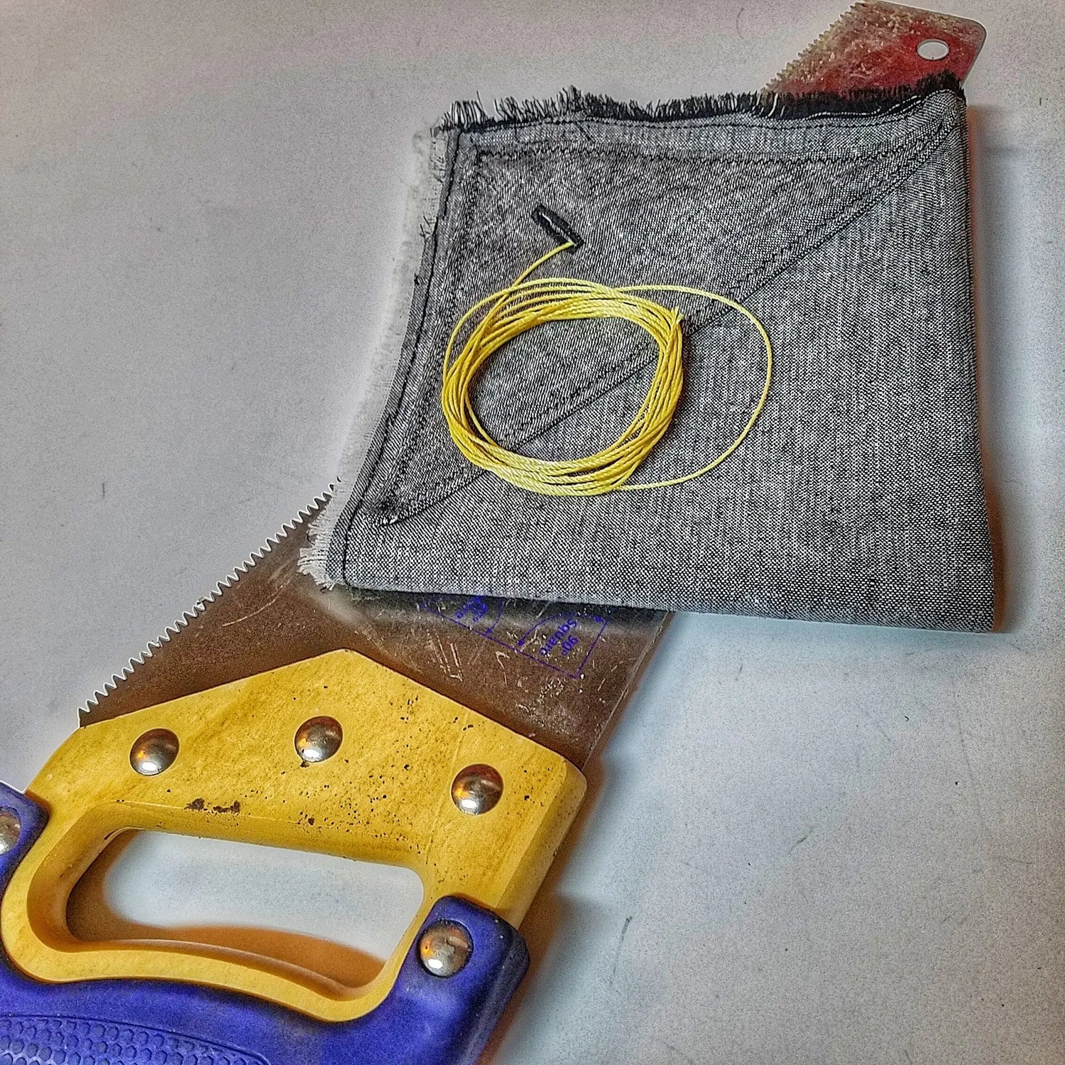 Saw Shemagh: Firestarter sewn button, built-in Kevlar Utility Saw, Fire Tinder border. Superesse Straps LLC