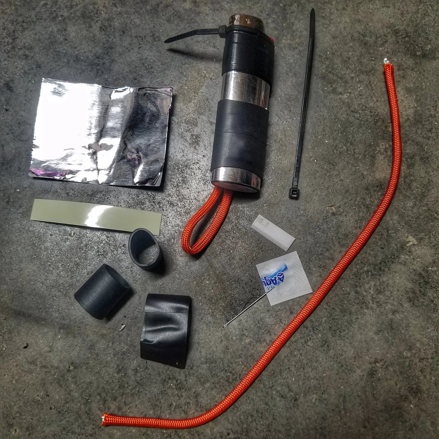 Survival Kit Lighter - Fire Starter outfitted with supplies. Superesse Straps LLC