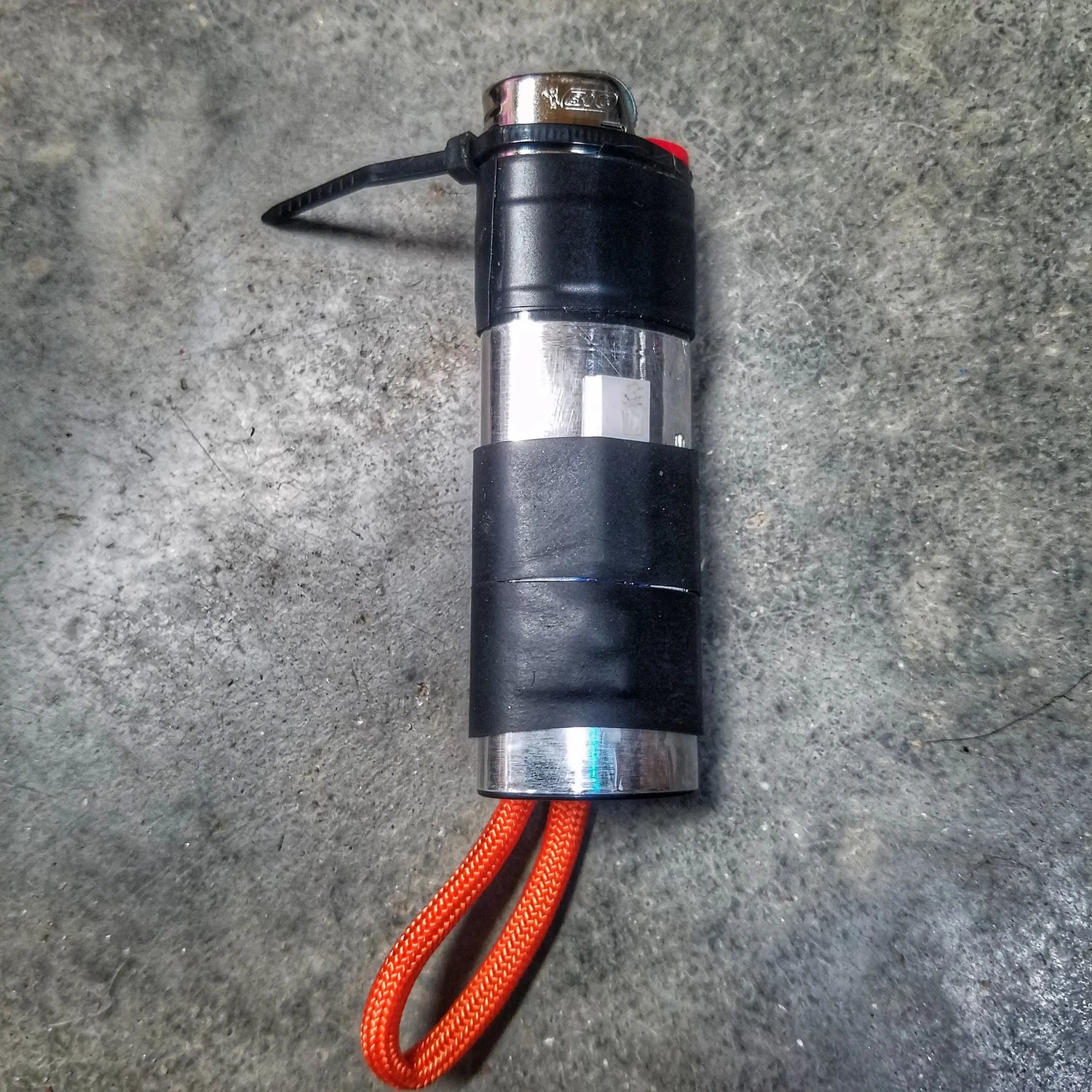 Survival Kit Lighter - Fire Starter outfitted with supplies. Superesse Straps LLC