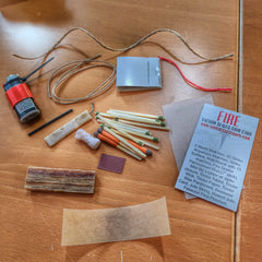 Survival Kit Lighter - Fire Starter outfitted with supplies. Superesse Straps LLC