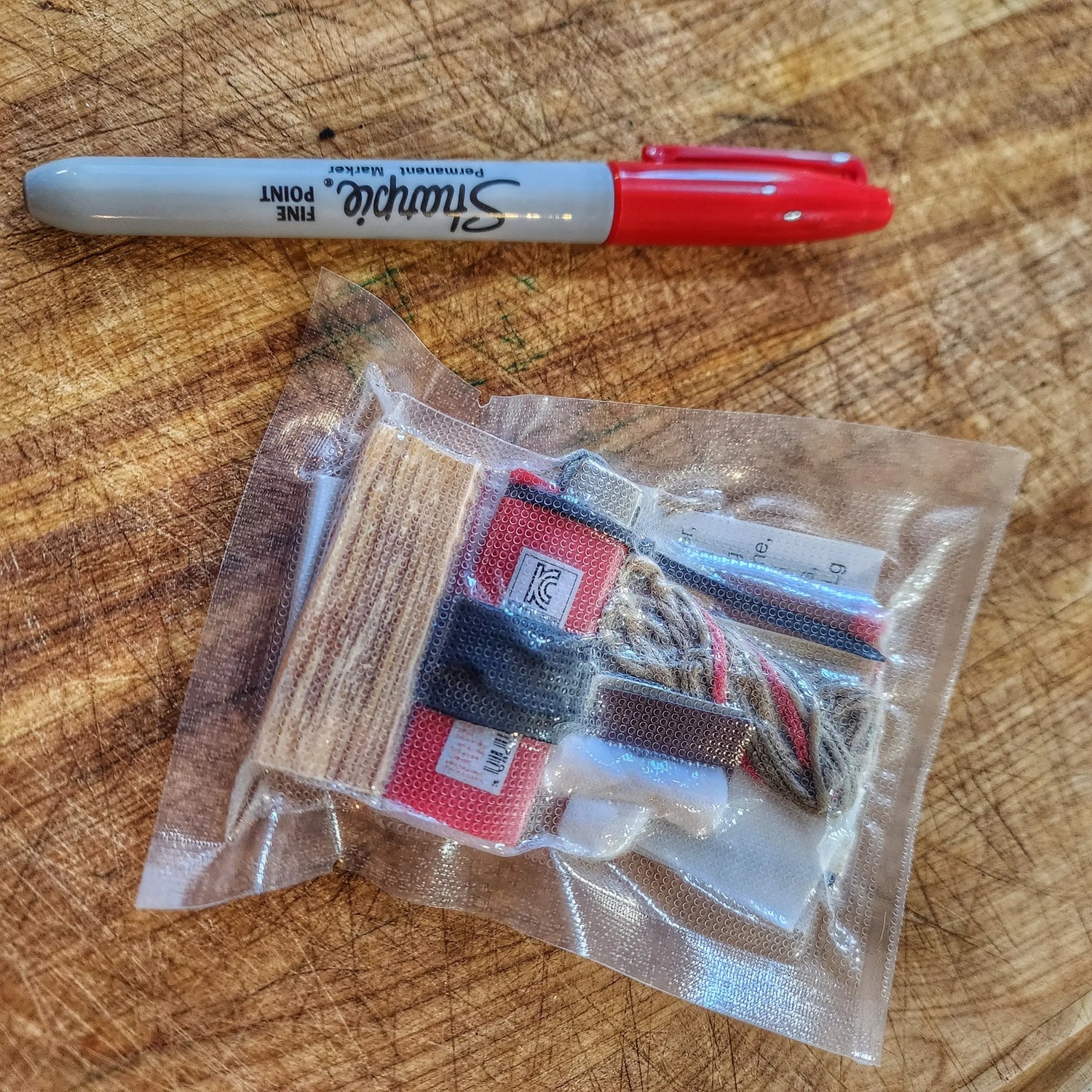 Survival Kit Lighter - Fire Starter outfitted with supplies. Superesse Straps LLC